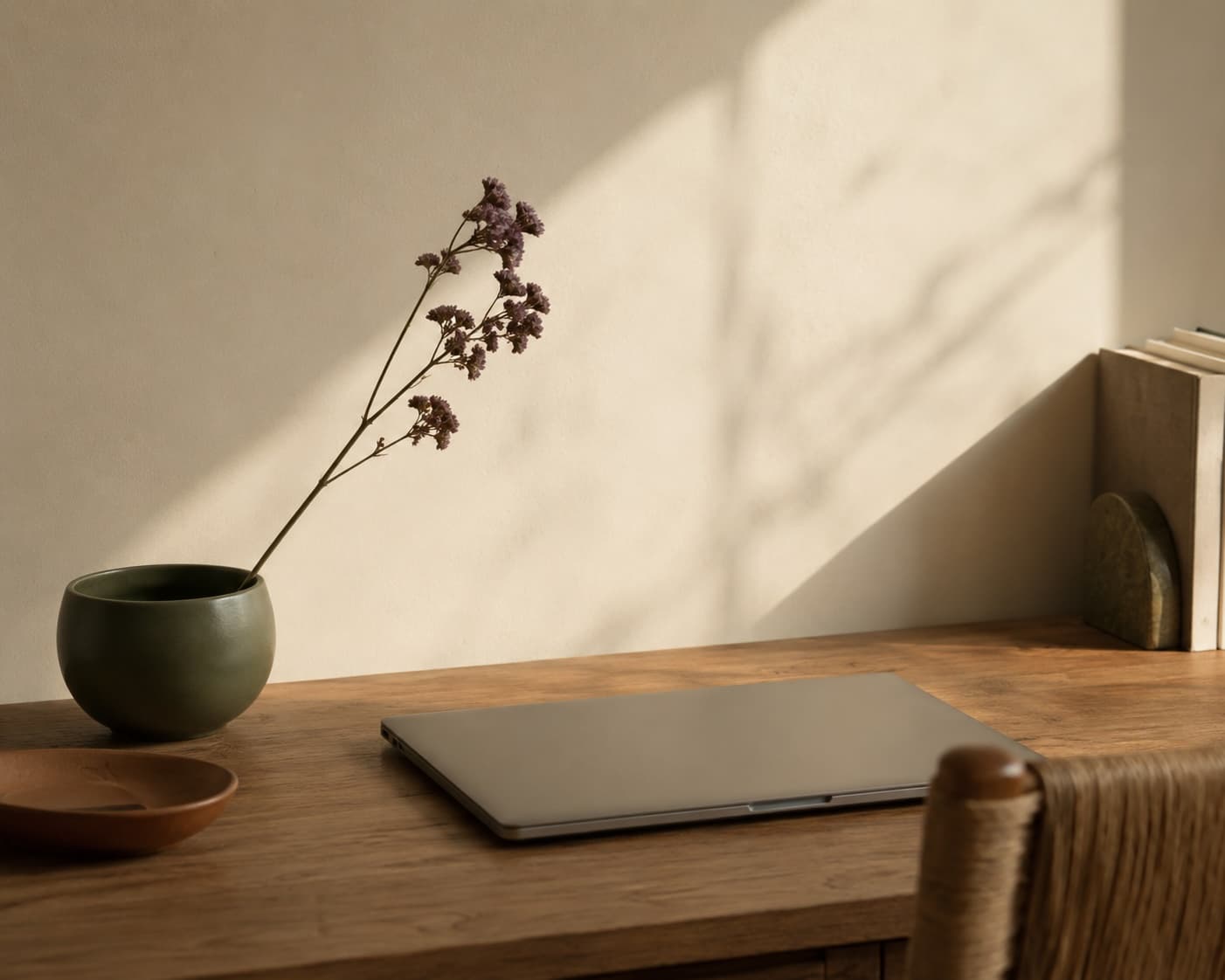 Desk with laptop and notebook